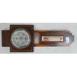 A oak cased barometer: with an inscription presented to F A Humpreys by Northampton district