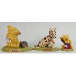 A collection of Royal Doulton Winnie the Pooh figures to include: Pooh Began to eat WP28 limited