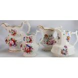 A collection of 19th Century Floral pottery jugs: tallest 26cm,