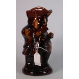 Treacle glazed Toby Jug: An early 19th century treacle glaze Toby jug 24cm high.