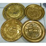 A Collection of Mid Century Brass Wall Plaques: diameter of largest 52cm(4)