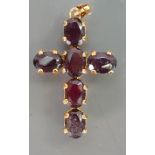 9ct gold crucifix set with brown stones: 3.5 grams.