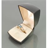 9ct gold ladies dress ring set with three aqua stones:size P, 3.2 grams.