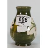 Moorcroft small vase decorated in the Bermuda Lily design: height 9.5cm.