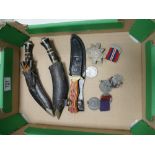 A mixed collection of items to include: Small Kukri Knives, similar sheath knife,