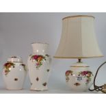 A collection of Royal Albert Old Country Roses pottery:to include table lamp, vase and urn & cover.