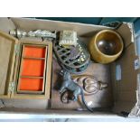 A collection of item to include: cast iron trivets, carved wood panel, wooden box ,