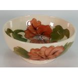Moorcroft footed bowl decorated in the hibiscus design: diameter 16cm.