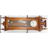A reproduction walnut Vienna wall clock: