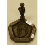 A bronzed reproduction ashtray: featuring cherub, Hitler and the words Belgium.