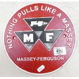 A reproduction Massey Ferguson metal sign: diameter 24cm