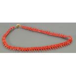 Vintage coral bead necklace with 18ct gold clasp: