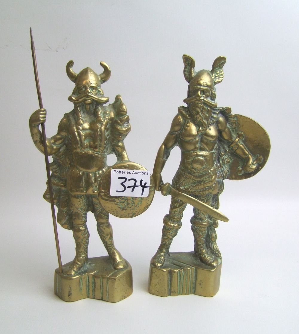 A pair of brass Viking figures: 27cm in height.