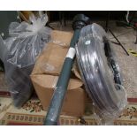 A mixed collection of items including: rubber hoses, plastic bottles, insulation etc.