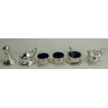 Two silver cruet sets: weighable silver 285g, some spoons not silver or matching.