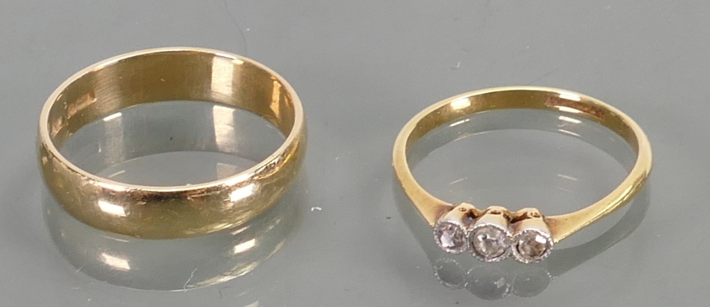 2 gold rings 18ct & diamond plus 9ct band: Weight 1.4g & 2.4g respectively.