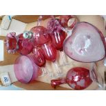 A collection of Cranberry Glass to include : bottles, vases, small wine glasses,