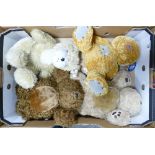 A collection of four cuddly Teddy bears: