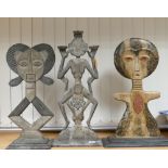Three oriental theme wooden figures: one as a candle holder (3)