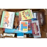 A collection of vintage toys to include: board games, wooden blocks, corgi buses,