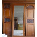 Large Edwardian Walnut Triple wardrobe: with carved decoration.