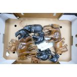 A collection of carved wooden elephants: (9)