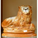 20th Century Staffordshire type figure of a lion: height 25cm