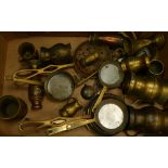 A collection of brass ware items to include: Goblets, frying pans,