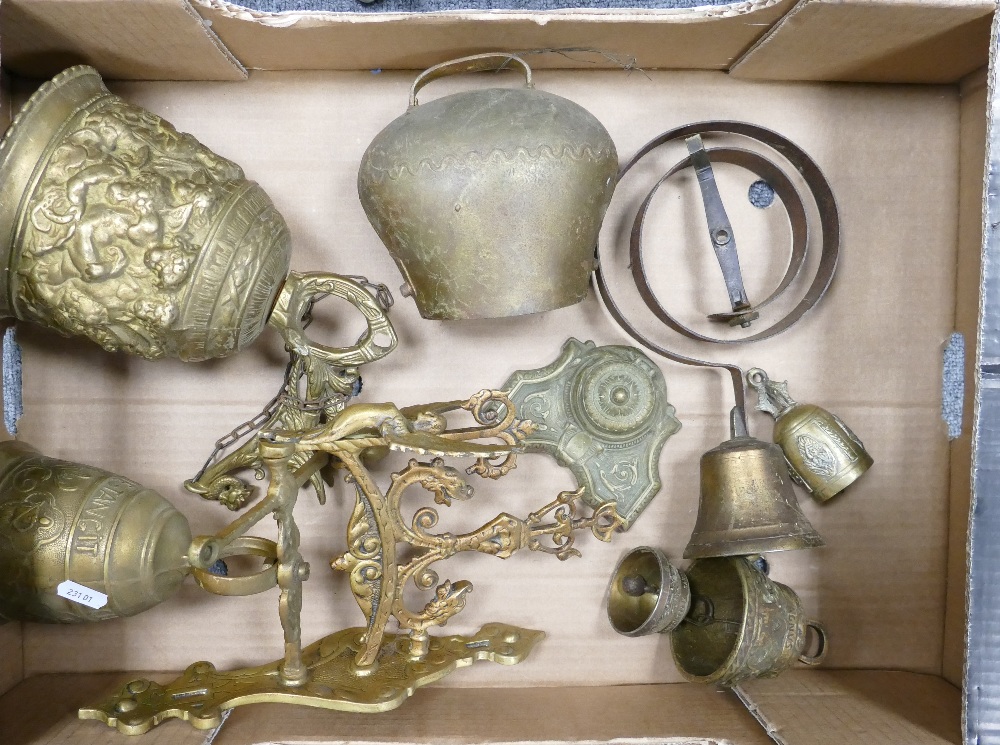 A collection of brass ware items to include: decorative exterior bells, door bells,