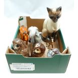 A collection of ceramic animals: to include a seated siamese cat, barn owls, a Kowe dove, brwon