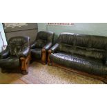 Oak framed three piece suite with green leather: three seater settee and two arm chairs