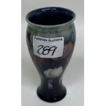 A Moorcroft Wisteria pattern vase: 13cm in height.