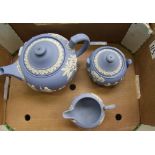 Wedgwood blue jasperware tea service: to include teapot, milk jug and sugar bowl (3).