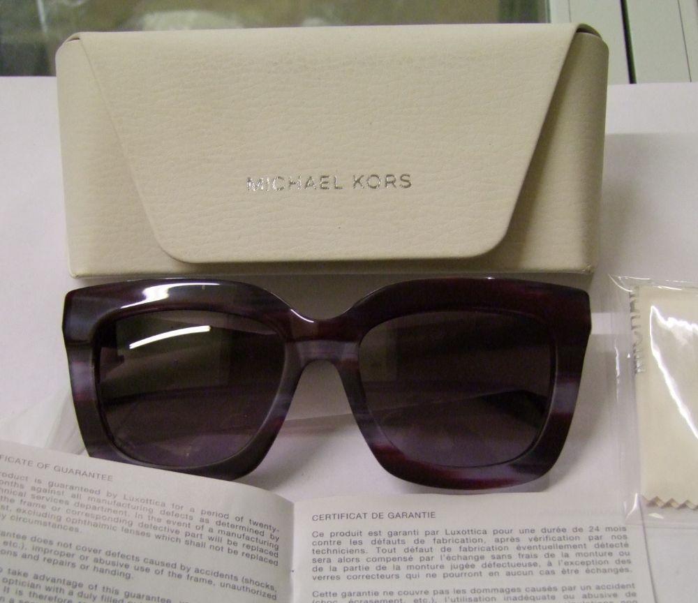 Five pairs of Michael Kors unisex sunglasses: cased.