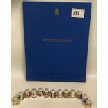 A collection of Royal Crown Derby thimbles: together with a matching hard back book (15)