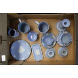 A collection of Wedgwood blue jasperware items: to include tankards, candle holders etc (14).