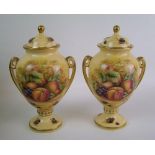 A pair of Aynsley Orchard Gold pattern lidded urns: height 23cm.