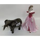 A Beswick Elephant figure with trunk in salute: together with a Coalport figure of the year 1994