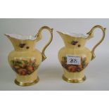 A pair of Aynsley Orchard Gold pattern jugs: height 15cm.