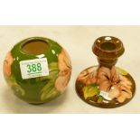 Moorcroft Hibiscus on Green Ground Lighter Base: together with similar brown ground candlestick(2)