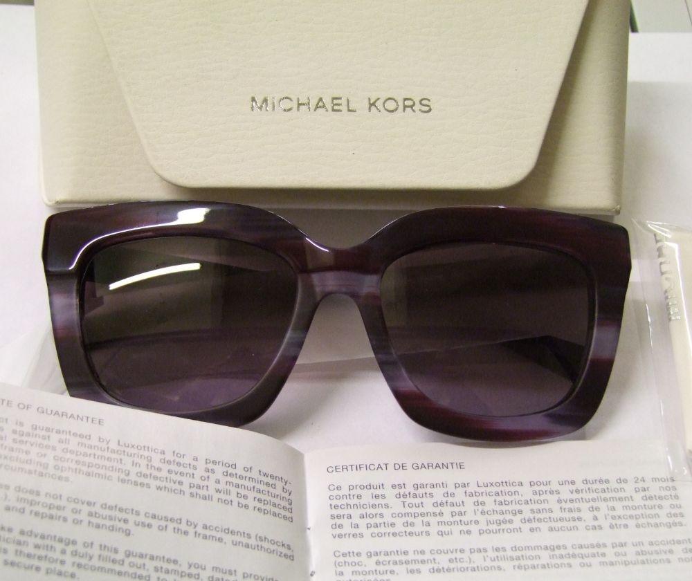 Five pairs of Michael Kors unisex sunglasses: cased.