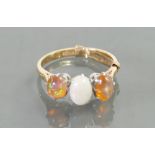 18ct & platinum ring: Set with opals, size K, 3.1 grams.
