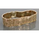 9ct gold bracelet decorated with Egyptian scenes: 22.7 grams.