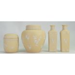 A collection of Wedgwood Yellow Jasper Ware to include: jar and covers, vases etc,
