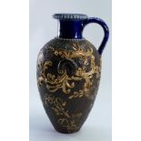 Doulton Lambeth Slaters Jug: Decorated and gilded with scrolling foliage, height 18.25cm.