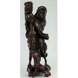Chinese hardwood figure of man with puppets: Height 39cm. (crack to base).