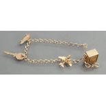 9ct gold Charm bracelet with 4 charms: 10 grams.