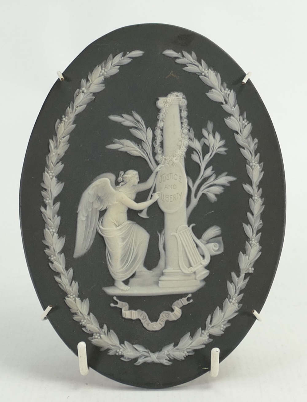 Wedgwood black Jasperware oval plaque 'Justice and Liberty 1914-1919', height 18cm.