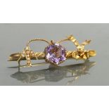15ct antique bar brooch set with amethyst stone: Bird & bow decorated with seed pearls, 4.2 grams.