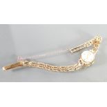 9ct gold ladies Rotary wristwatch with 9ct gold bracelet: 12.1 grams.